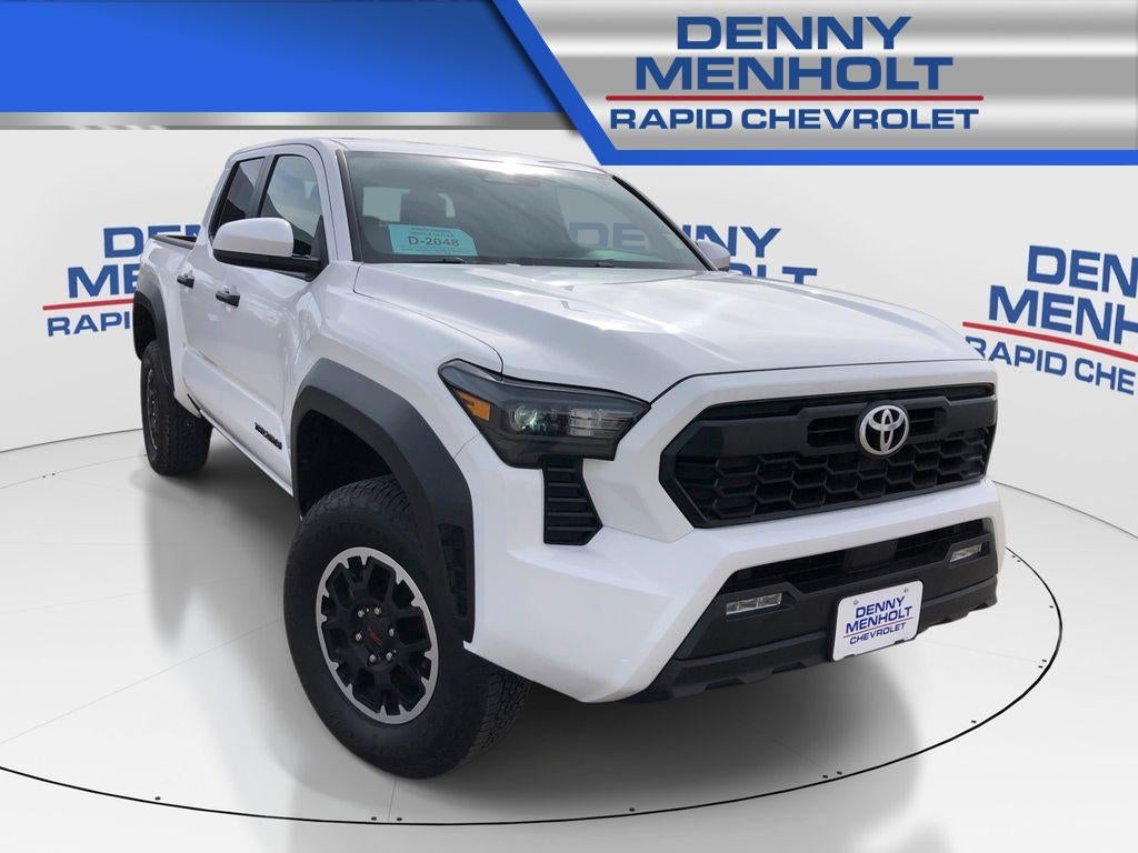 2025 Toyota Tacoma TRD Off Road in White — front three-quarter view